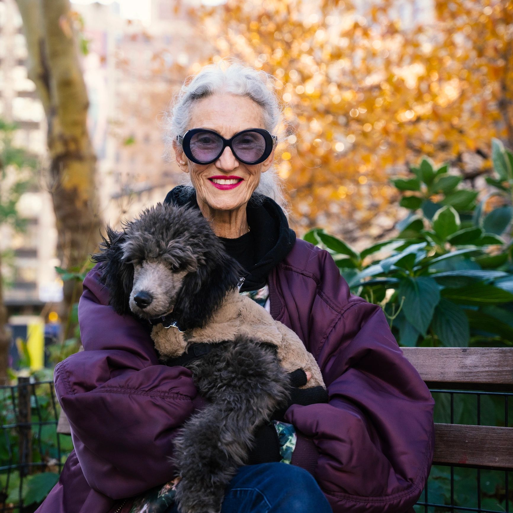 Smiling dog owner with her dog